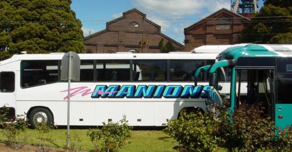 Photo of Manions Buses parked on side of road